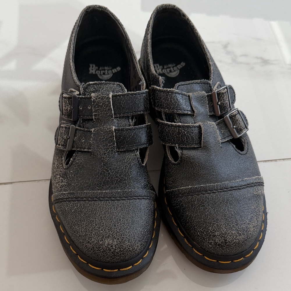 Dr. Martens woman’s charcoal Distressed Double-Strap Leather Shoes